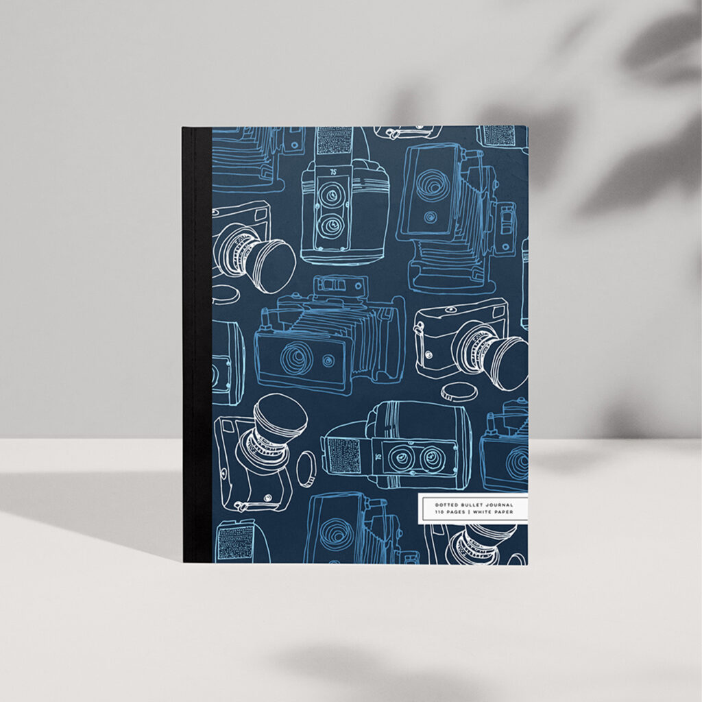 Handy notebooks with whimsical vintgae camera illustrations in pink and blue versions.