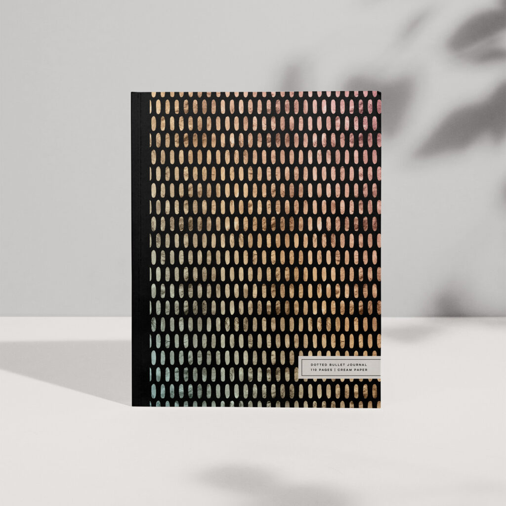 Iridescent metallic ovals dot this sophisticated blank journal, ready for filling with your notes and designs.